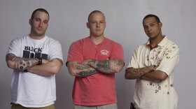 Travis Conques (left), a medic, with fellow soldiers Kit and Cody (both infantry). 
