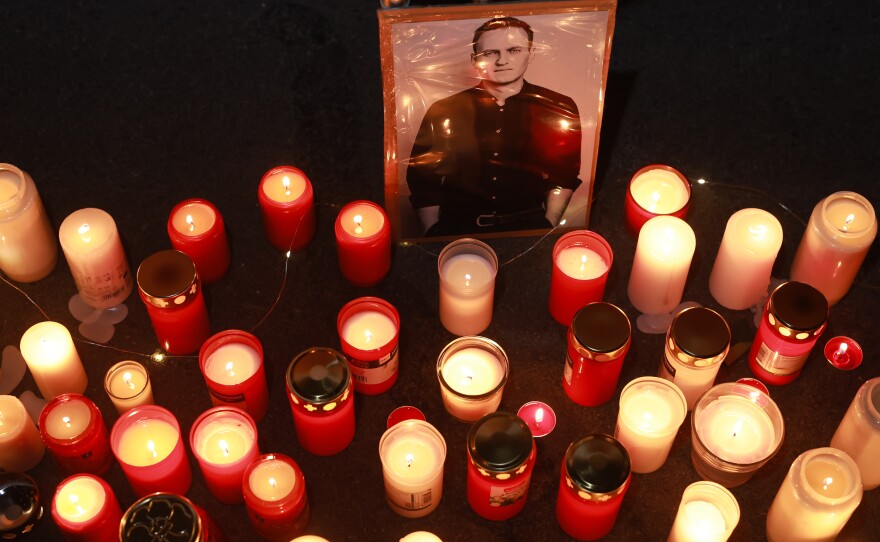 People light candles during a vigil for Navalny in front of the Russian Consulate General on February 16 in Munich, Germany.