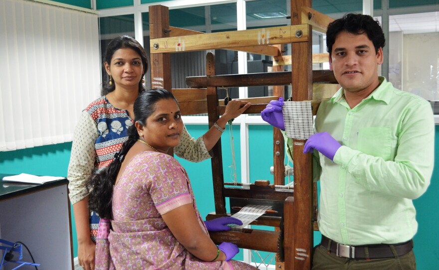 Sobha (center) is one of the weavers who turn silk into test strips. To her left is Tripurari Choudhary, a design engineer at Achira Labs. To her right is Mithila Azad, a company director.