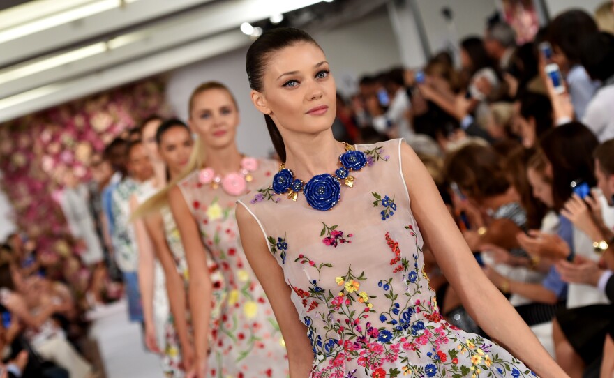 Models walk the runway at the Oscar de la Renta fashion show during Mercedes-Benz Fashion Week Spring 2015 on Sept. 9 in New York City.