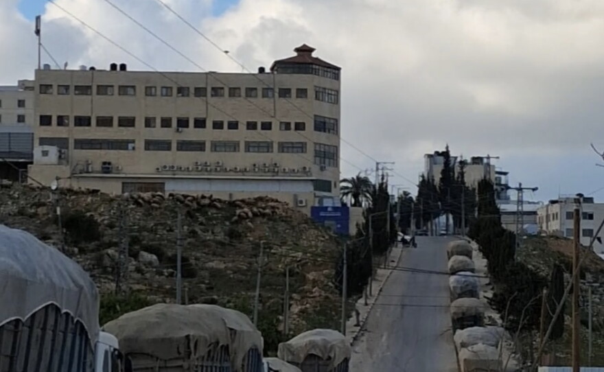 Garbage trucks are parked outside the transfer station waiting for the optimum time to try to get through all the additional Israeli checkpoints set up around the West Bank since October 7, 2023.