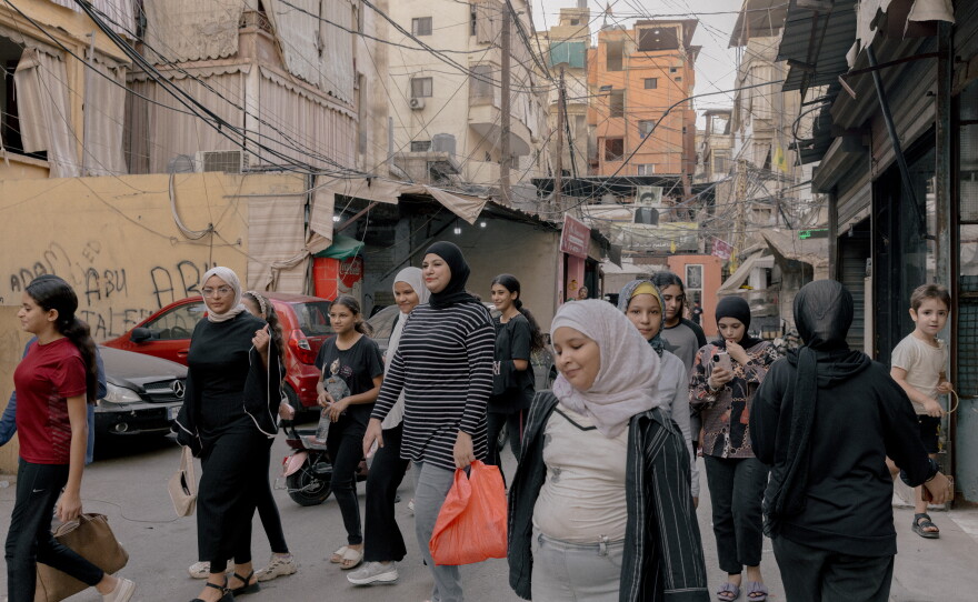 Girls leave the jiu jitsu class and cross the refugee camp of Bourj el Barajneh in South Beirut. 