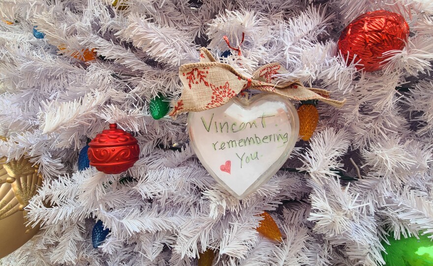 A Christmas ornament made in remembrance on the Mama's Kitchen AIDS memorial Tree of Life on display at the Village Hillcrest, Dec. 1, 2022. 