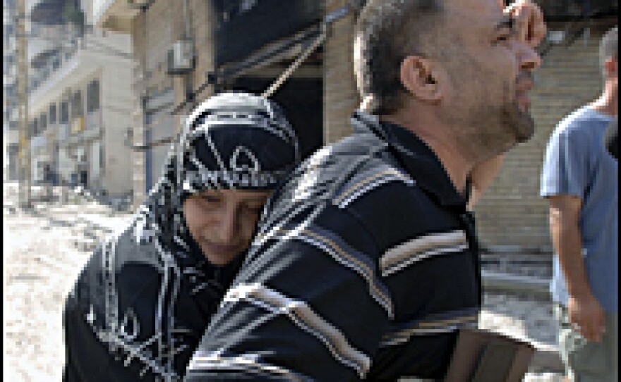 Residents observe the rubble-filled steets after more Israeli airstrikes July 23, 2006, Lebanon. U.N. humanitarian chief Jan Egeland arrived in Beirut, as the U.N. seeks to secure safe routes out for fleeing civilians.