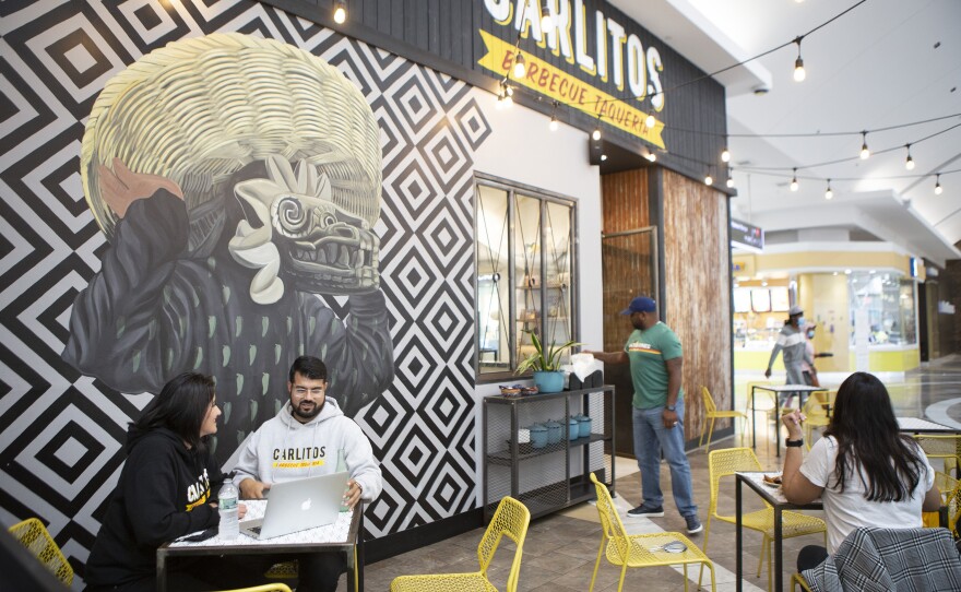 Castillo (left) visits her husband, Carlos, who owns Carlitos Barbecue Taqueria in Paramus, N.J. She tries to visit him about three times a week, sometimes with the kids and sometimes without them.