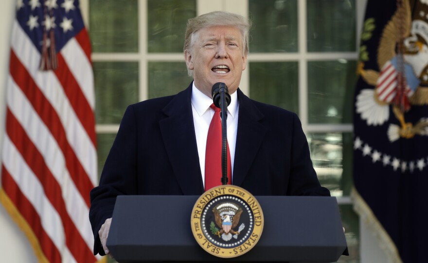 President Trump speaks in the Rose Garden of the White House on Friday, saying he will endorse a short-term spending deal to end the government shutdown.