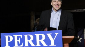Texas Gov. Rick Perry smiles as he takes the stage to speak to supporters at his victory party Tuesday night at the Salt Lick BBQ in Driftwood, Texas.