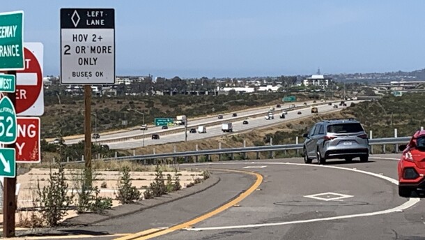 Vehicles drive onto State Route 52 west at Santo Road in San Diego on April 28, 2026.