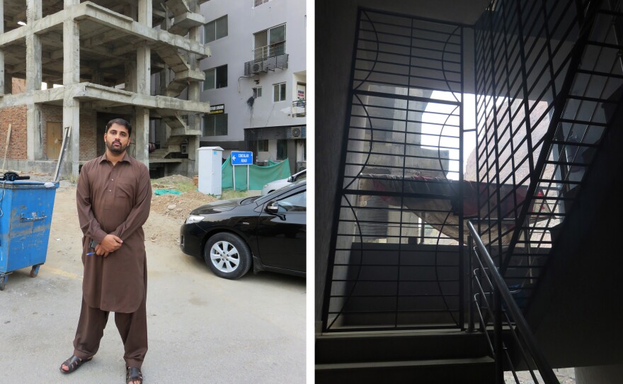 Police detective Aizaz Azam (left) stands outside the apartment block where 24 impoverished Pakistanis were imprisoned by a kidney trafficking gang. Barred windows on stairs leading to the apartment kept prisoners from escaping.