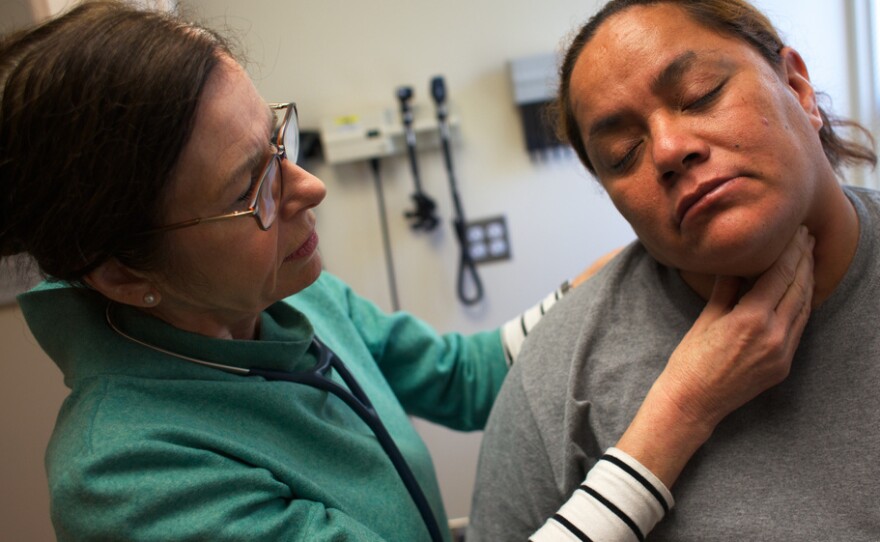 Nurse Practioner Tina Clark examines Anastacia Casperson at the Glide Health Clinic in San Francisco.