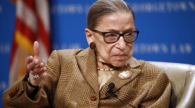 In this Feb. 10, 2020, file photo, U.S. Supreme Court Associate Justice Ruth Bader Ginsburg speaks during a discussion on the 100th anniversary of the ratification of the 19th Amendment at Georgetown University Law Center in Washington. 