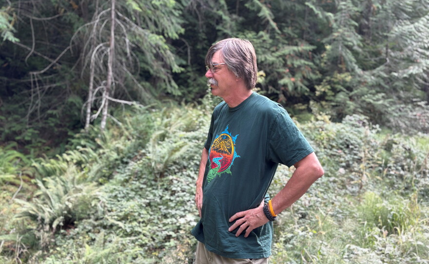 Retired U.S. Forest Forest Service firefighter Timothy Ingalsbee stands by a road in the Willamette National Forest, which was once the epicenter of the so-called Timber Wars.