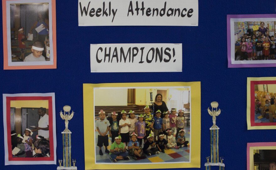 A poster in the hallway of Weemes Elementary recognizes students with positive attendance rates.