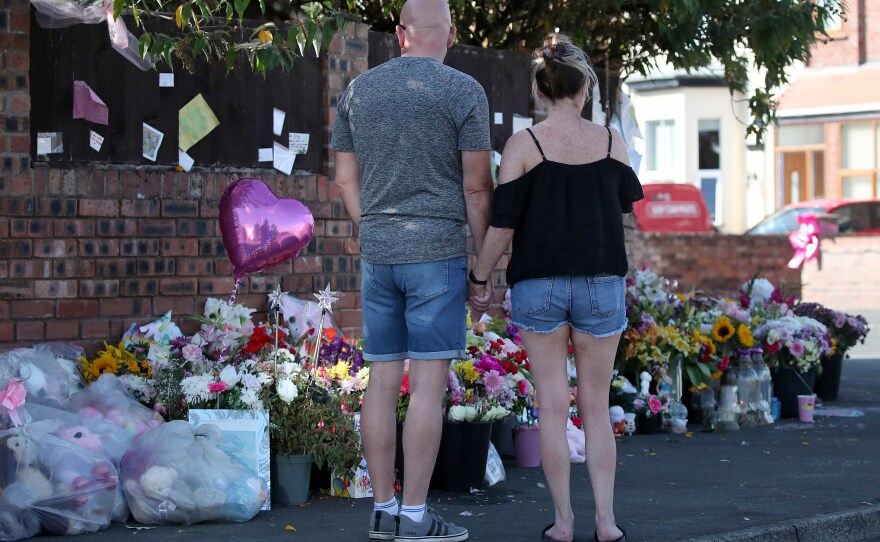 FILE - Floral tributes are left at the site in Southport, England, Aug. 11, 2024 after three young girls were killed in a knife attack at a Taylor Swift-themed holiday club.