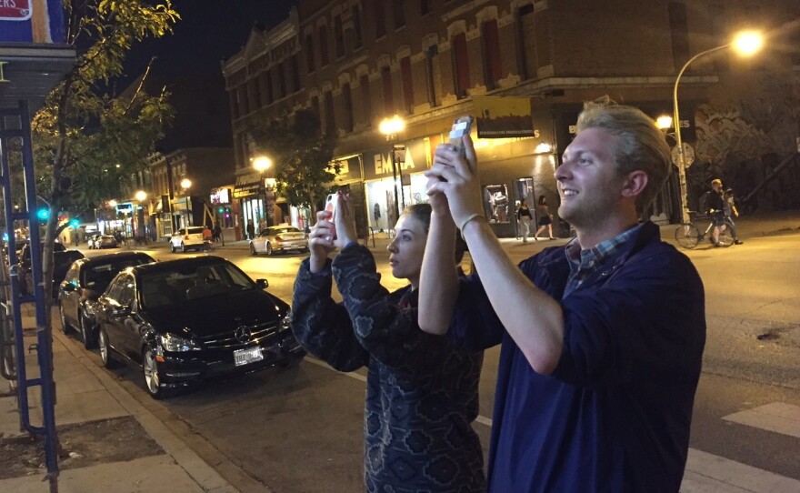 Louise Price and Stanley Opalka, two of the many people taking pictures of the world's first boozy Taco Bell.