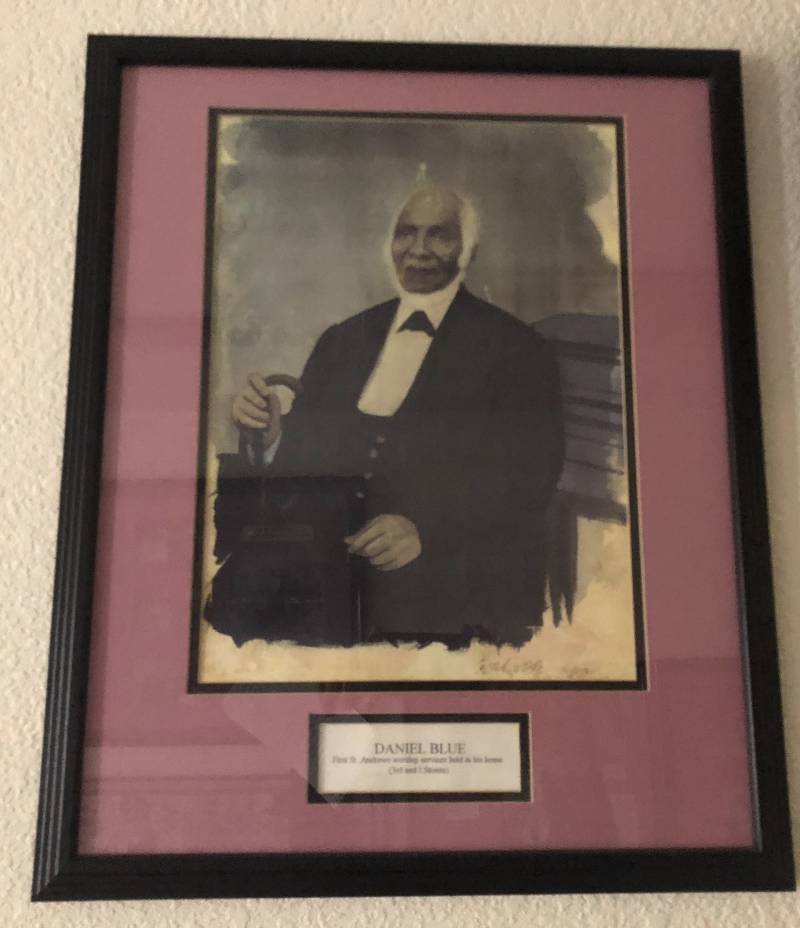 A portrait of Daniel Blue hanging on the walls of St. Andrews African Methodist Episcopal Church.