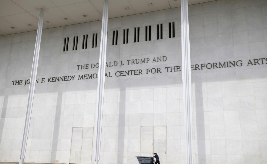 A man wheels a garbage bin outside of The John. F. Kennedy Center for the Performing Arts, Saturday, June 6, 2026, in Washington.