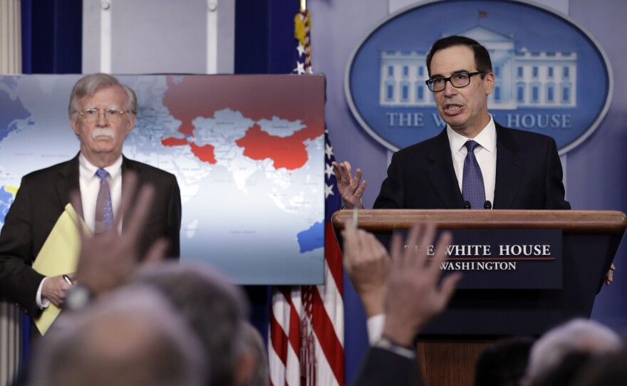 Treasury Secretary Steven Mnuchin (right) and National Security Adviser John Bolton announce sanctions against Venezuela, which are meant to put pressure on Venezuelan President Nicolás Maduro.