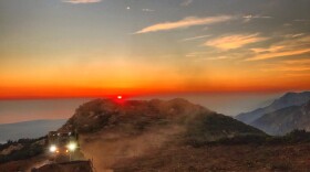 A dozer from the Santa Barbara County Fire Department clears a fire break across a canyon from atop Camino Cielo down to Gibraltar to make a stand should the fire move in that direction, Wednesday, Dec. 13, 2017. 