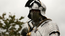 Medieval combat expert in armor.