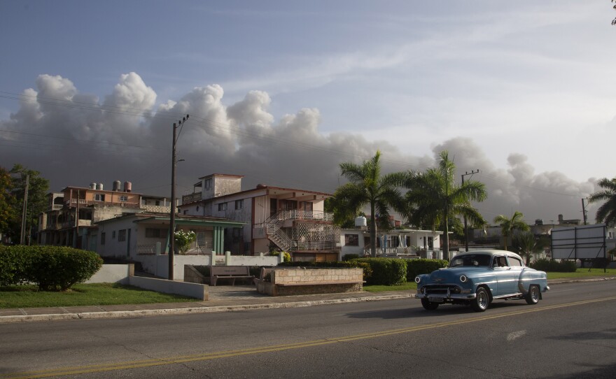 Smoke rises from a deadly fire at a large oil storage facility in Matanzas, Cuba, on Tuesday. The fire was triggered by lighting that struck one of the facility's eight tanks late Friday.