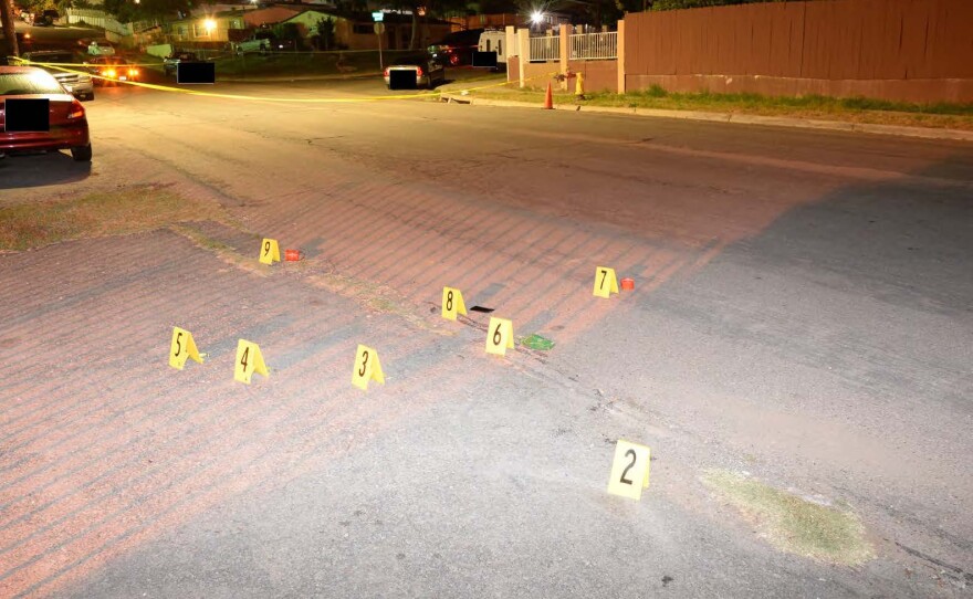 Bullet casings are marked on Skyline Drive after police officers shot a man, Aug. 25, 2012.