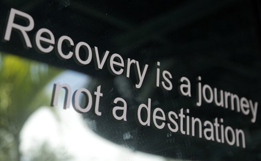 This 2017 photo shows a slogan is on the storefront of Journey, a former substance abuse treatment center, in Lake Worth, Fla. Now closed, it was one of two centers owned by Kenneth Chatman, who is now serving a 27-year federal prison sentence for health care fraud and money laundering convictions.