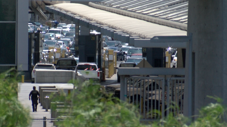 Cars wait in line to cross the San Ysidro border to San Diego, Aug. 3, 2018. 