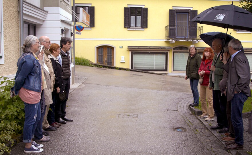 The descendants stand in Ubelbach in the place their fathers were lined up as prisoners of war by Nazis on the 75th anniversary of the crash.