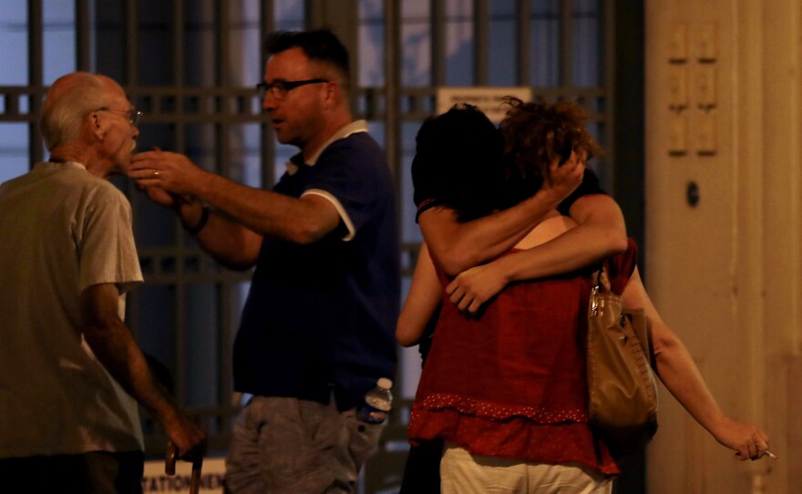 People in Nice react in the early hours of Friday morning after the attack.