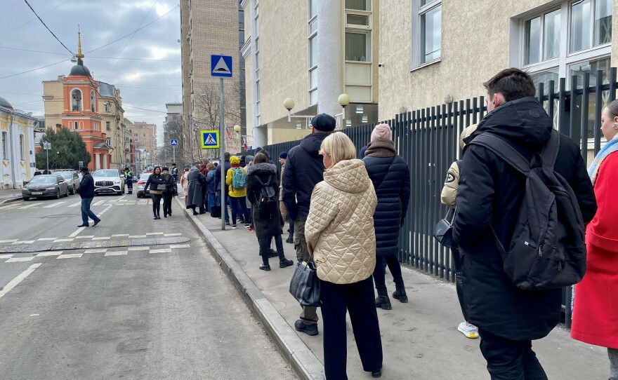 Russian voters outside a voting precinct in central Moscow on Sunday as part of the "Noon Against Putin" protest.