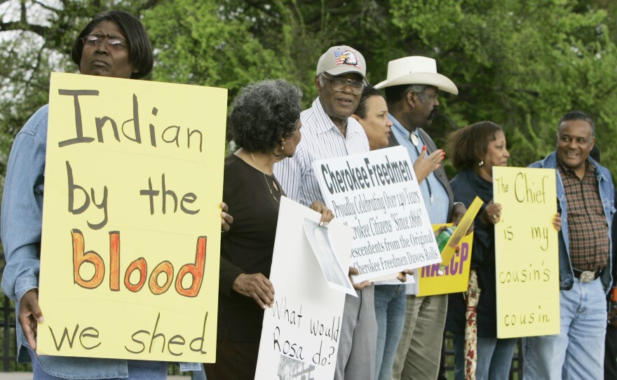 Waynetta Lawrie (left), of Tulsa, Okla., stands with others at the state Capitol in Oklahoma City in 2007, during a demonstration by several Cherokee Freedmen and their supporters.