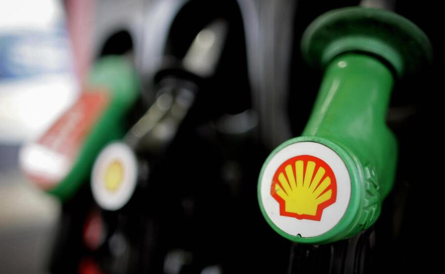 The Royal Dutch Shell logo is shown on a gas pump at a London Shell garage.