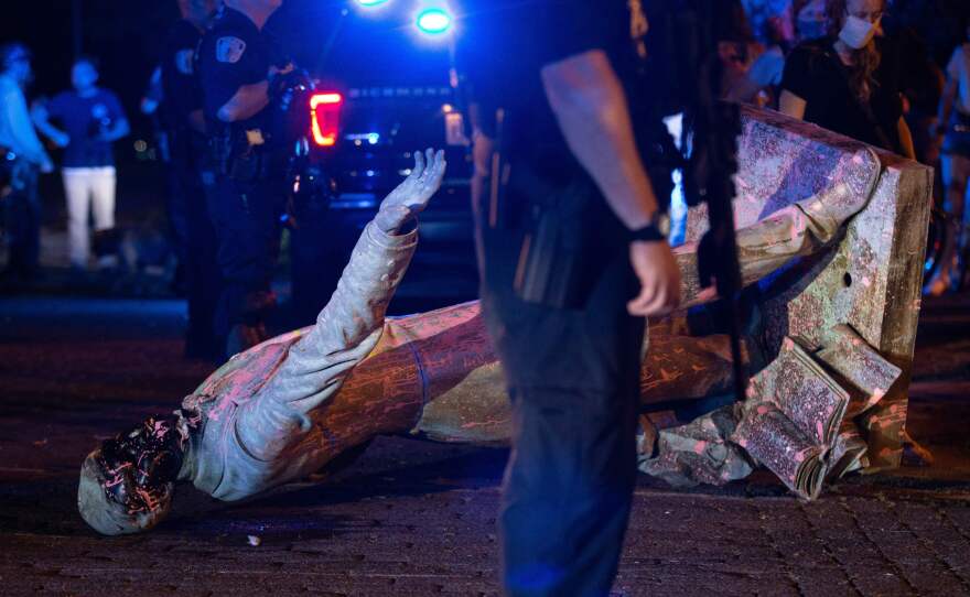 A statue of Confederate States President Jefferson Davis lies on the street after protesters pulled it down in Richmond, Virginia, on June 10, 2020.