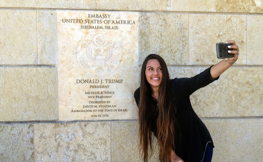 Beckah Shae, a Nashville-based singer-songwriter popular on Christian radio, snapped selfies with the dedication plaque outside the U.S. Embassy to Israel in Jerusalem.