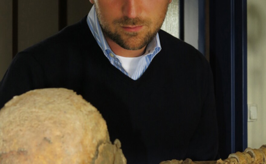 Presenter Michael Scott and skeleton from x tombs, Bordeaux University.