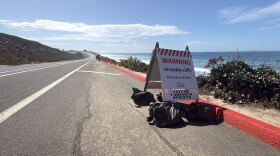 A sign warning beachgoers of unstable cliffs along south Carlsbad Boulevard, Sept. 10, 2026.
