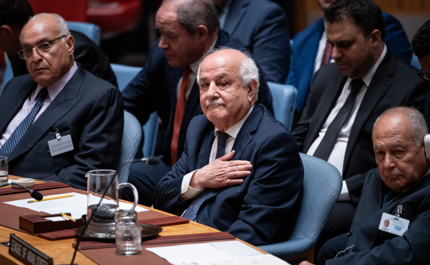 Palestinian Ambassador to the United Nations Riyad Mansour pats his heart during the Kuwait crown prince's address at the High-Level Security Council meeting on Palestinians and Israel during the 80th session of the United Nations General Assembly, Sept. 23, 2025.