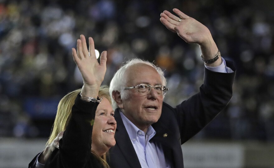 Democratic presidential candidate Sen. Bernie Sanders, I-Vt., waves with his wife, Jane, after his speech at a campaign event in Tacoma, Wash., on Feb. 17.