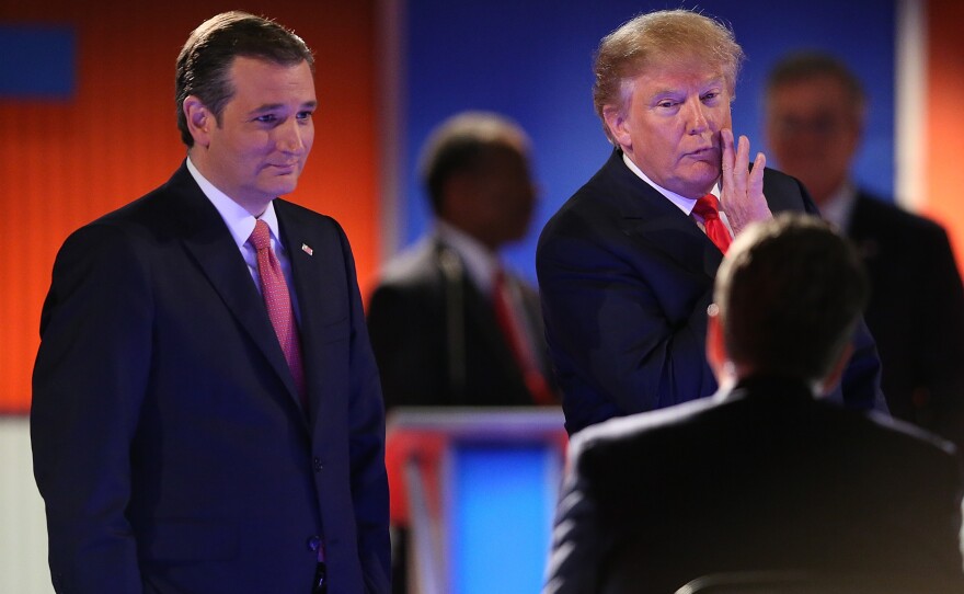 Sen. Ted Cruz and Donald Trump speak to moderators during a break in the Fox Business Network Republican presidential debate in North Charleston, S.C., on Thursday.