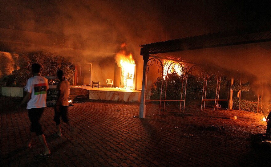 A vehicle and surrounding buildings burn after an attack inside the U.S. consulate compound in Benghazi, Libya, on Sept. 11, 2012.