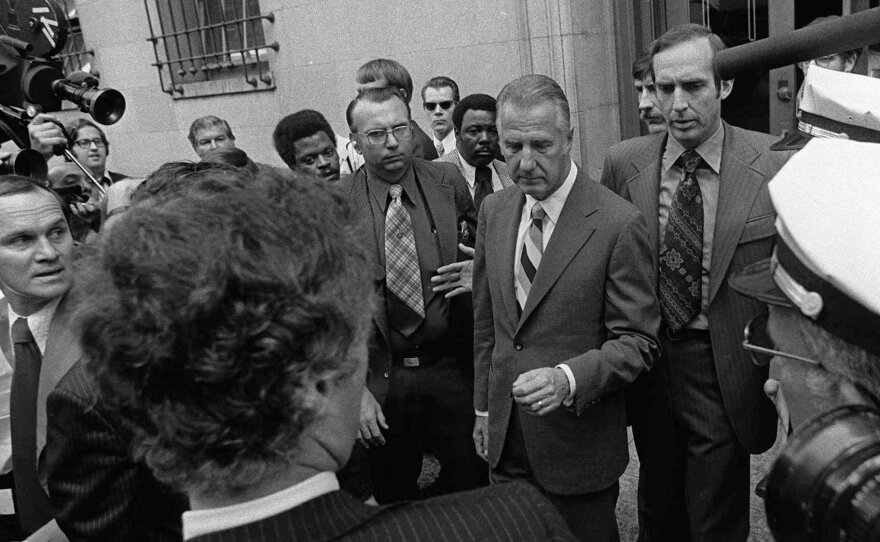 Spiro T. Agnew (center) pleaded no contest to a charge of income tax evasion — after attacks against the judicial system. Agnew resigned from the vice presidency.