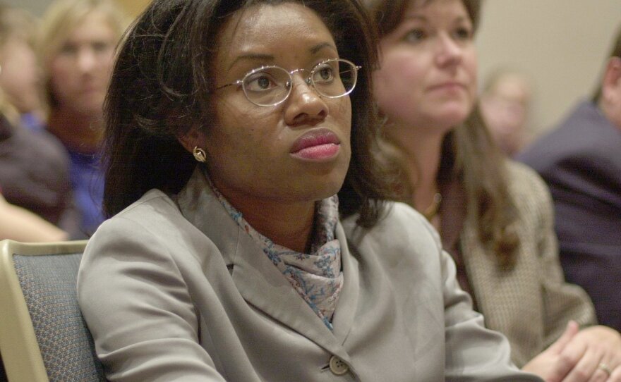 In this photo from Nov. 2001, Winsome Sears, left, attends a student leadership forum at Oscar Smith High School in Chesapeake, Va. Sears' victory against a Democratic incumbent in the House of Delegates that month stunned her opposition.