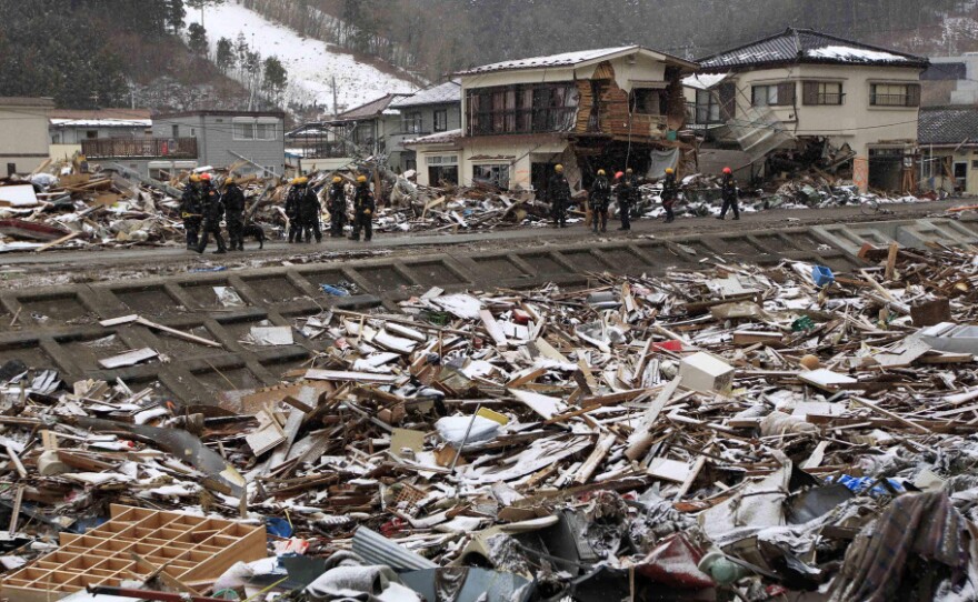 Members of a U.S. search and rescue team from Los Angeles County stand in snow Thursday while on a recovery operation in Kamaishi, Japan. Two search and rescue teams from the U.S. and a team from the U.K., with combined numbers of around 220 personnel, are helping in the aftermath of the earthquake and tsunami.