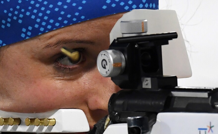 French biathlete Anais Chevalier competes at the shooting range in the women's 4x6-kilometer relay on Feb. 22. Her team won bronze.