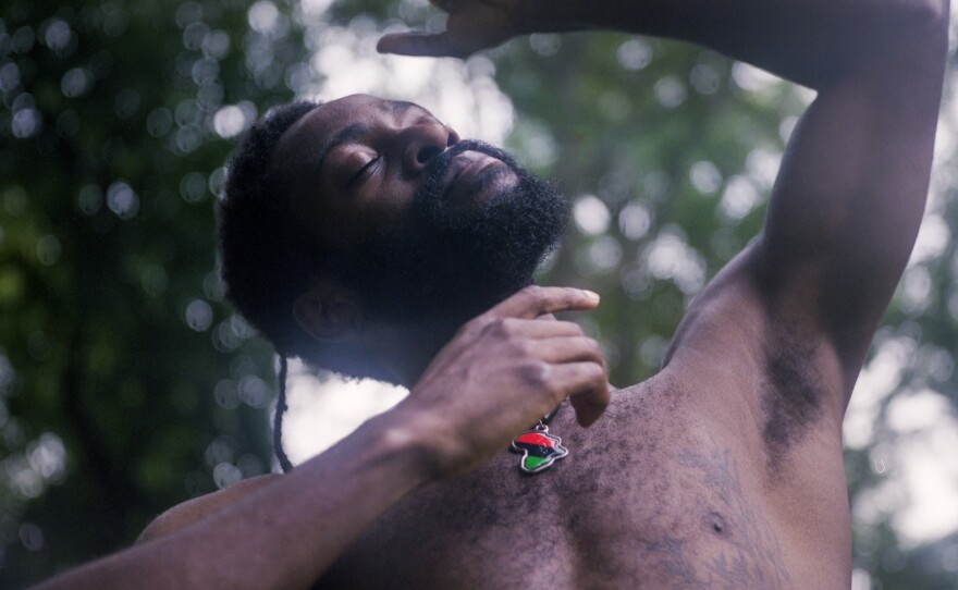 Photographer Maria J Hackett says this photograph "was created as I developed deeper questions into what it means to be Black in America. Not by what we are defined through from the outside or mainstream, but by how many of us personally translate pain as well as push to truly define ourselves and find peace through our inner being, despite our everyday struggles."