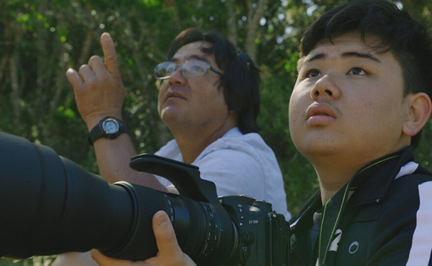 Jared (right) and his father birding. In preparation for the world's largest convening of high school scientists, teenage innovators from around the globe create cutting-edge solutions to confront environmental threats while navigating the doubts and insecurities of adolescence.