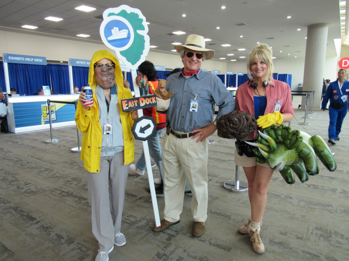From the left: Gayle Hooker, Mark Sherman and Samantha Shortman pose as characters from the 1993 film "Jurassic Park" on July 25, 2024 at Comic-Con.