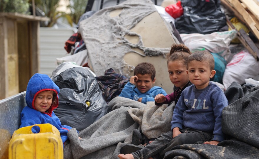 Displaced Palestinians in Rafah in the southern Gaza Strip pack their belongings following an evacuation order by the Israeli army on Monday amid the ongoing conflict between Israel and the Palestinian Hamas movement.