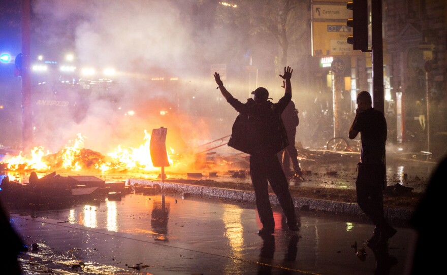 Anti-G-20 Summit protesters set fires during clashes with riot police in Hamburg, Germany, Friday night.